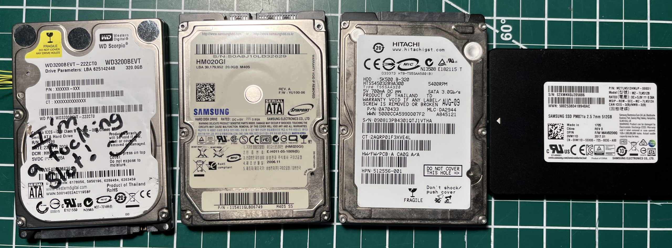 Four HDDs and SSDs used as test subjects: Samsung HM020GI, Hitachi HTS545032B9A300, Western Digital WD3200BEVT, Samsung PM871a