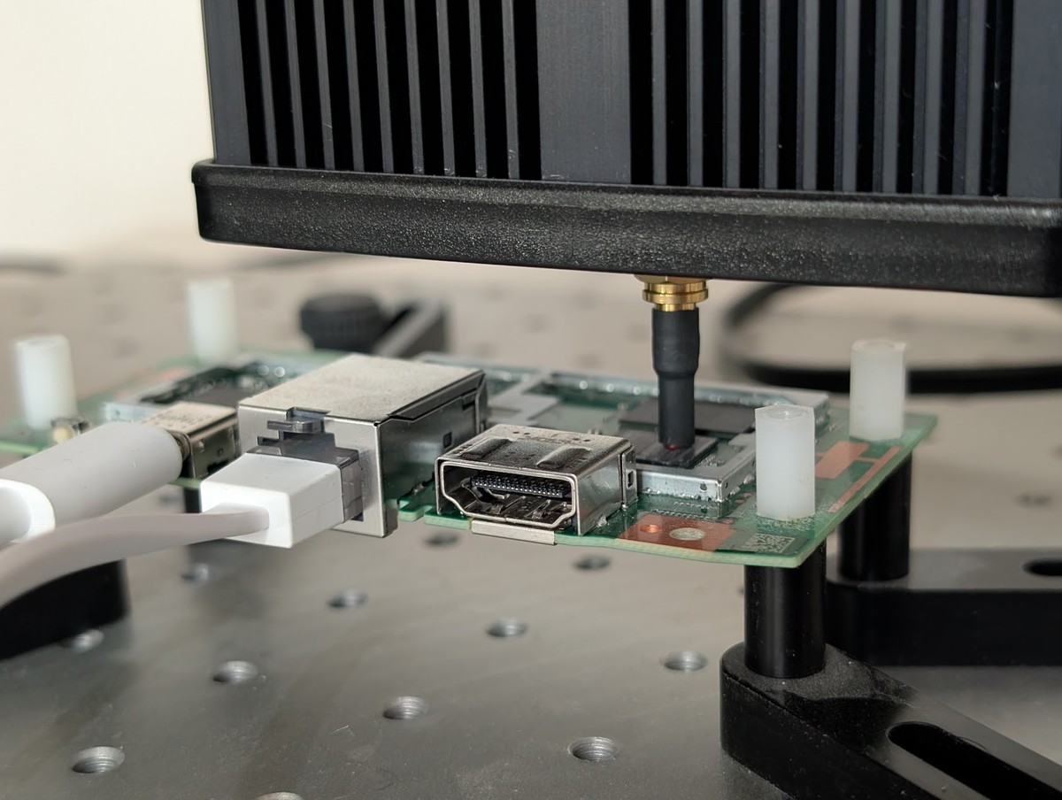 Close-up photograph of the EMFI probe positioned on the MT8696 chip surface