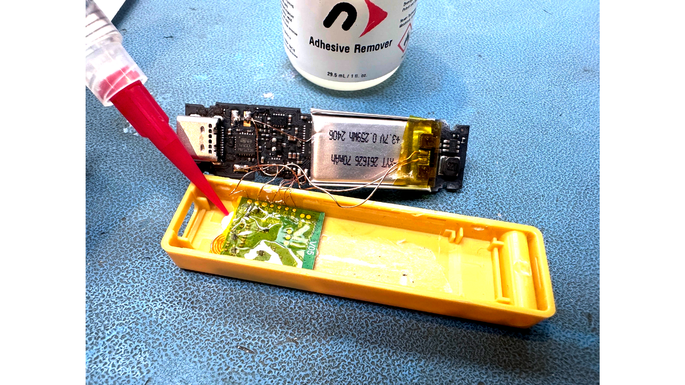 Green V05 implant board glued into the yellow Nano X case shell with 70 mAh battery